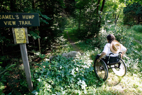 Deborah Lisi-Baker starts her wheelchair up the View Trail at Camel's Hump in Duxbury, Vt. The Camel's Hump View Trail is part of a nationwide push in the past 20 years to make more of the great outdoors accessible to people with disabilities.
