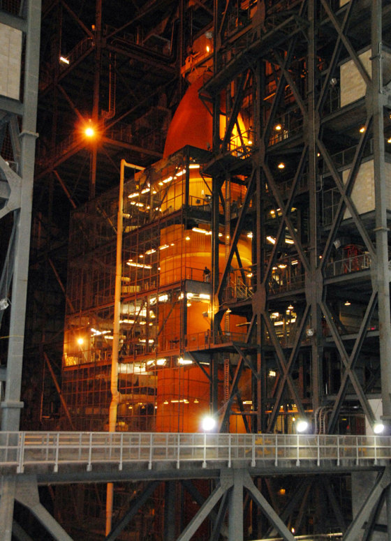 The fuel tank destined for the shuttle Discovery's launch in October sits in NASA's Vehicle Assembly Building. Tests have revealed cracks in the insulation around the tank's fuel-line brackets, officials say.