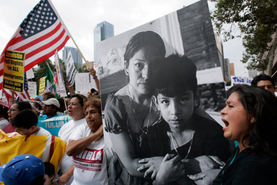Protesters carry a portrait of immigration activist Elvira Arellano and her 8-year-old son, Saul, during a demonstration in Los Angeles on Saturday. Arellano was deported after leaving a Chicago church where she had taken refuge to draw attention to the plight of illegal immigrant parents. 