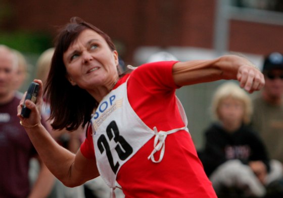 Eija Laakso of Finland tosses a mobile phone