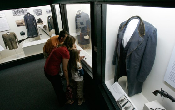 A family looks at one of the displays at the Museum of the Confederacy in Richmond, Va. The museum bills itself as home to the world's largest collection of Confederate artifacts. 