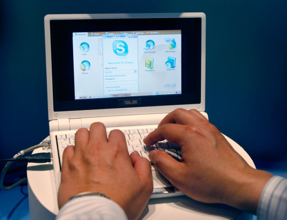 File photo of a salesman for Asustek Computer Inc. showing the new Eee PC 701 notebook during the 2007 Computex trade show in Taipei