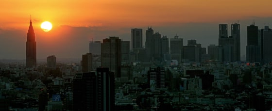 The sun sets behind Tokyo's Shijuku skys