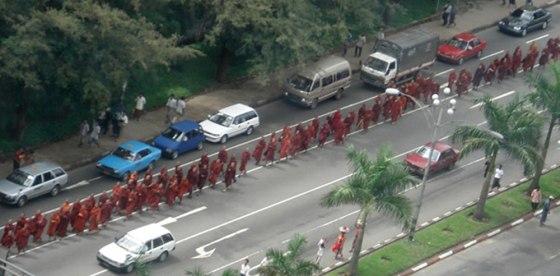 Buddhist monks march whilst chanting prayers and holy scriptures in Yangon