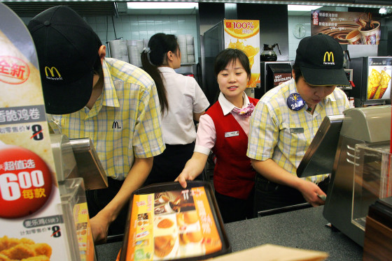 Chinese workers go about their business