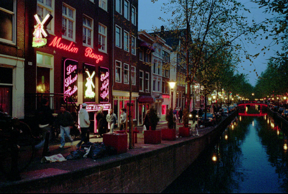 A non-profit corporation in Amsterdam has purchased a large number of Red Light District buildings where prostitutes posed in windows.