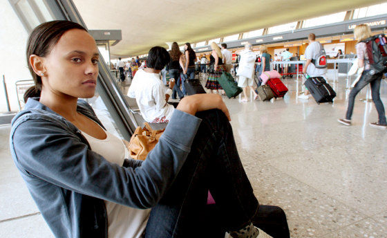 Christina Wright-Lyons, from London, waits in the main terminal at Dulles Airport for another flight to Heathrow, after a two-day delay in New York. A new U.S. aviation bill approved by the House of Representatives demands U.S. airlines and airports come up with plans to provide passengers stranded by long delays with food, water and other basic amenities.