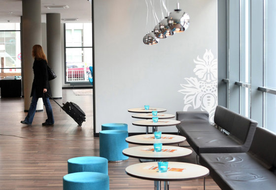 A customer enters the lobby of Motel One in Berlin. Berlin's Mayor Klaus Wowereit once famously described his eternally broke city as "poor, but sexy" — and a new crop of sleek budget hotels are betting that economy minded tourists and business travelers like it that way.