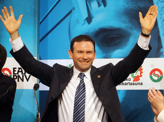 Basque premier Ibarretxe greets supporters following Basque regional elections in Vitoria, northern Spain