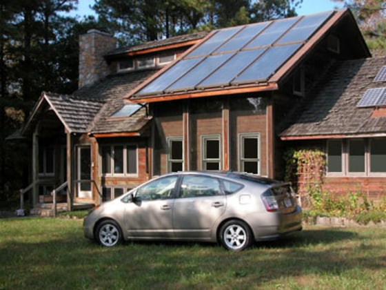 Is this lifestyle in the cards for you? A hybrid Prius sits in front of a Raleigh, N.C., home powered by the sun and built by Enertia Building Systems, which has built similar homes in 30 states.