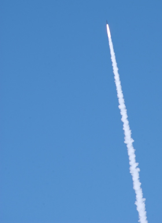 A Ground-based Interceptor breaks cloud cover, shortly after launch from Vandenberg Air Force Base in California