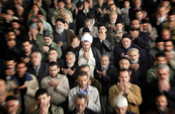 Iranians worshippers perform the weekly