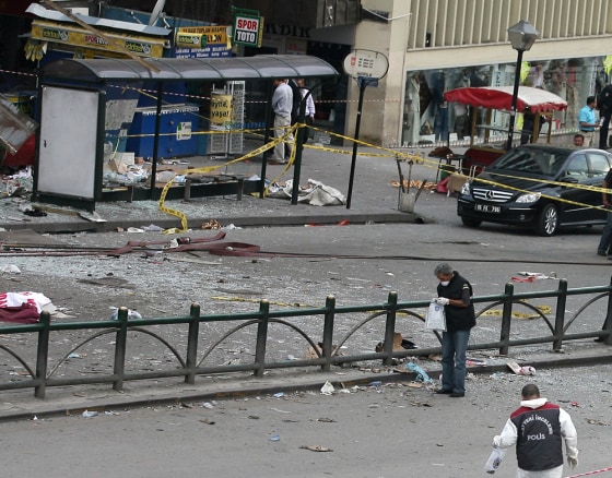 Officials collect evidence Tuesday at the site where an explosion killed six people and injured 80 in Ankara.