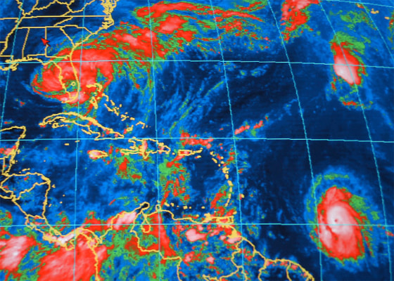 An infrared satellite image from the National Oceanic and Atmospheric Administration shows Hurricane Frances at upper left over Florida on Sunday, with Hurricane Ivan at lower right, about 800 miles east-southeast of Barbados.