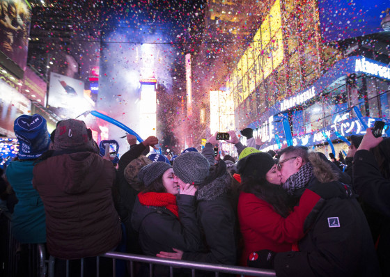 Miranda Echerarria and Christian Prieto, of Niagra, N.Y. kiss at the stroke of midnight during the New Year's Eve celebrations in Times Square, Wednesday, Jan. 1, 2014, in New York. (AP Photo/John Minchillo)