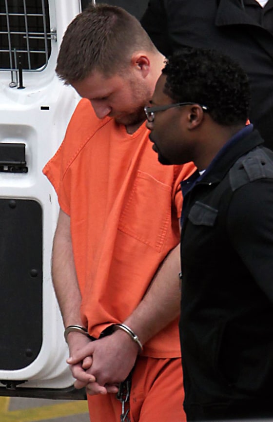 Image: Conrad Alvin Barrett, 27, is escorted out of the Bob Casey Federal Courthouse