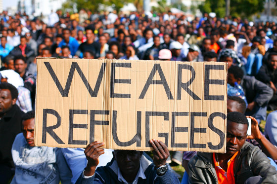 A man holds a sign during a demonstration in south Tel Aviv against Israeli government policies towards African migrants.