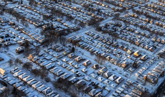 Houses and streets are covered with a blanket of snow in Chicago, Ill., on Jan. 6. A massive blast of bitterly cold air plunged temperatures across much of the USA to life-threatening lows not seen in nearly two decades.
