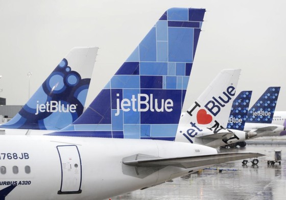 IMAGE: JetBlue airplanes at John F. Kennedy Airport in New York.