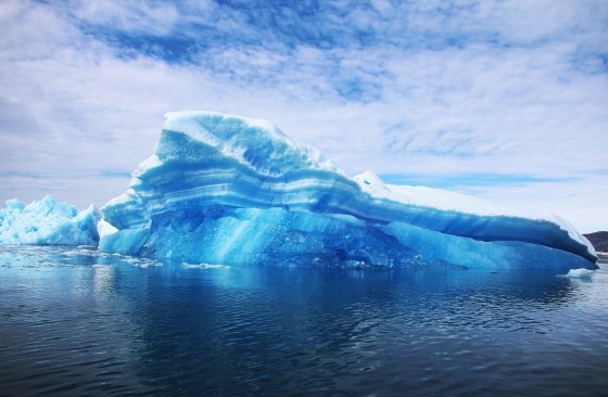 Image: Calved icebergs from the nearby Twin Glaciers float on the water in Greenland.