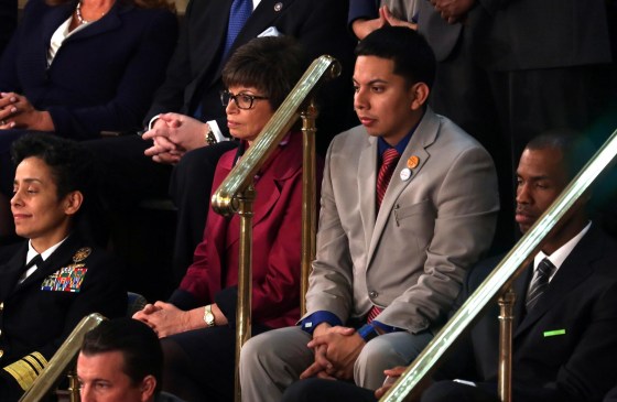 Image: Mi Familia Vota’s Cristian Avila (C) sits with Senior Advisor to the President of the United States Valerie Jarrett