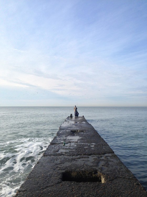 Image: A man fishes in the morning light on the Black Sea in Sochi, Russia.