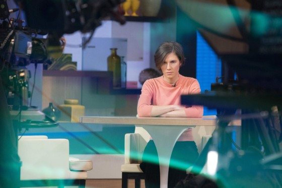 Image: Amanda Knox sits alone before being interviewed on the set of ABC's \"Good Morning America\" in New York