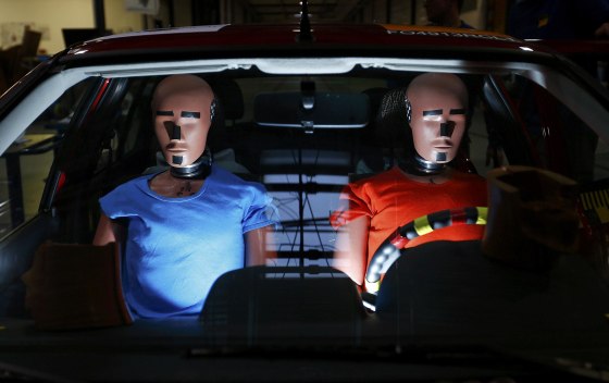 Dummies are prepared for a car crash-test at the laboratory of the German motor club ADAC in Landsberg December 5, 2013. The ADAC has a crash test facility accredited by Euro NCAP (New Car Assessment Programme) where it runs various tests probing new cars for safety under different scenarios, pedestrian protection and other automotive tests. The results about the safety of popular car models are freely available to readers on ADAC web site.