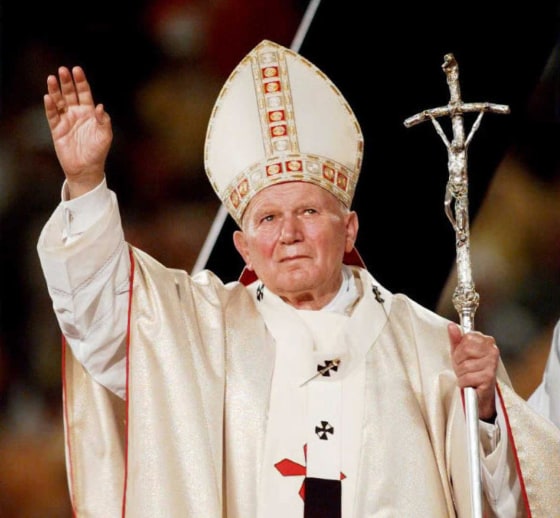 Pope John Paul II waves to the crowd gathered at G
