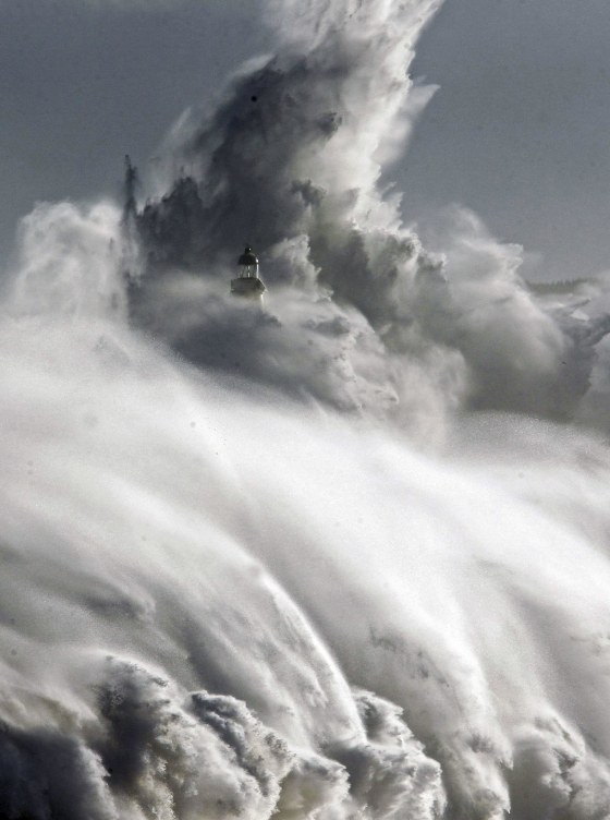 Large waves almost cover the lighthouse in Mouro island in front of port in Santander, northern Spain, Feb. 2. Spanish authorities issued a red alert with floods affecting some coastal villages due to the strong swell affecting Spanish northern coastline.