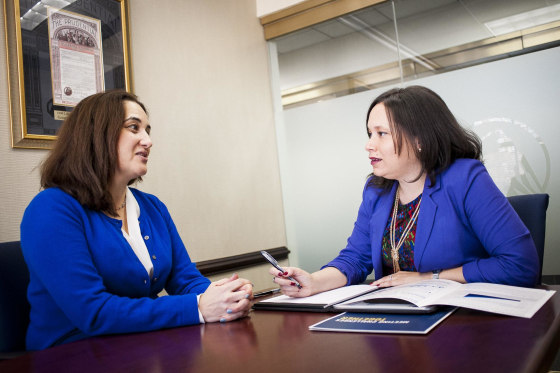Sylvia Tergas, a financial planner with Prudential Mid-Atlantic Financial Group, discusses investment strategy with her client Julie Diaz-Asper, owner of Social Lens Research.
