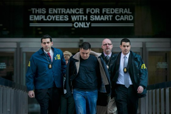 Image: Franco Lupoi, is escorted by FBI agents from their Manhattan offices in New York