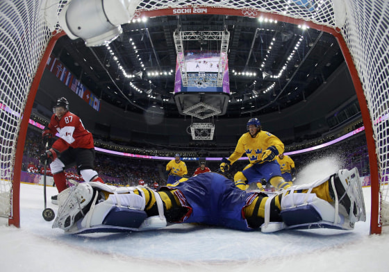Image: Canada's Crosby scores on a breakaway past Sweden's goalie Lundqvist during the second period of their men's ice hockey gold medal game at the Sochi 2014 Winter Olympic Games