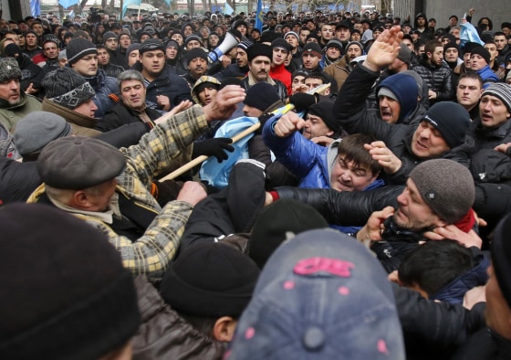 Image: Pro-Russian protesters, right, clash with Crimean Tatars