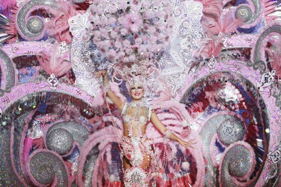 A nominee for Santa Cruz de Tenerife's Queen of the Carnival shows off her outfit under the watchful eyes of the judges on the Spanish Canary island of Tenerife on Wednesday. Dresses worn during the gala to elect the Carnival Queen are more than 16 feet high and over 175 lbs in weight. Known as the most “Brazilian” of all the Spanish carnivals, this year's festivities last from Jan. 31 - March 8.
