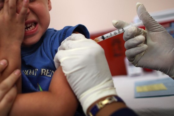 A 5-year-old boy receives an immunization shot from a school nurse in Florida. A new study finds public health messages aimed at increasing certain vaccination rates may have the opposite effect.