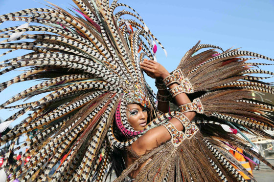 Image: Trinidadian model Soowan Bramble performs in an individual mas Carnival costume in Port-of-Spain