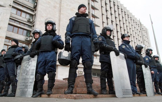 Ukrainian policemen stand guard at the Regional administration building in Donetsk on March 5.