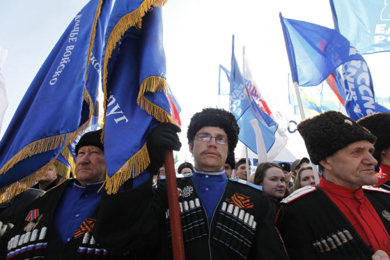 People hold a rally in the Russian southern city of Stavropol, in support of the people of Crimea on Friday.