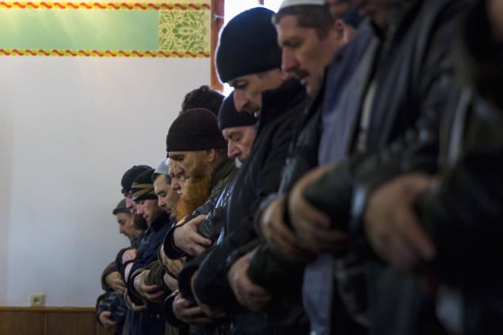 Image: Crimean Tatars pray in the Khan Chair mosque in Bakhchisaray, near Simferopol