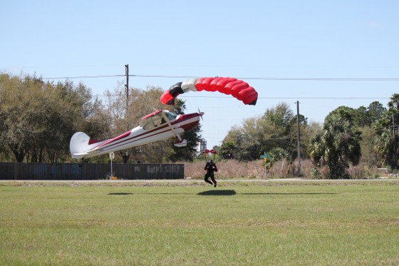 A plane became entangled in the strings of a skydiver's parachute, sending both crashing into the ground near Tampa, Fla. on March. 8, 2014.