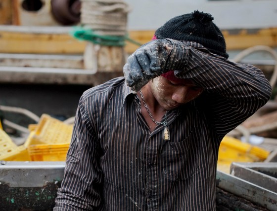 Migrant laborer on a Thai fishing boat on September 1, 2011 in Sattahip, Thailand's Rayong province. Thousands of men from Myanmar and Cambodia set sail on Thai fishing boats every day, but many are unwilling seafarers -- slaves forced to work in brutal conditions under threat of death.