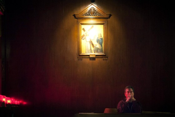 Image: A man prays during a service at St. Andrew's church in observance of Ash Wednesday in the Manhattan borough of New York