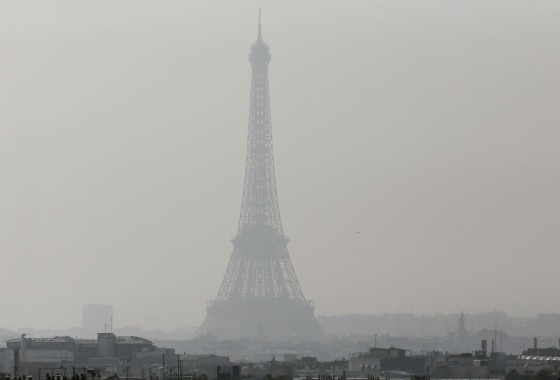 Image: A view of the Eiffel Tower seen through thick smog,