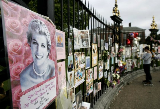 Pictures, notes and flowers placed by people are seen on the grounds of Kensington Palace in London, on the 10-year anniversary of the death of Princess Diana, Friday Aug. 31, 2007. It has been 10 years since her death in a Paris car crash, when many Britons were poleaxed by grief for a vivacious and troubled woman who was at once princess, style icon, charity worker and tabloid celebrity. (AP Photo/Lefteris Pitarakis)