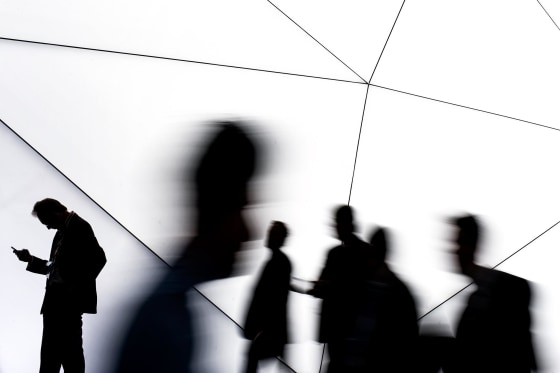 Image: People use mobile phones.