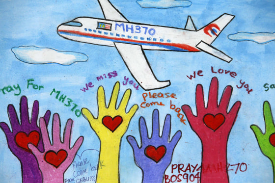 Image: An artwork conveying well-wishes for the missing Malaysia Airlines Flight MH370 is seen in Kuala Lumpur International Airport