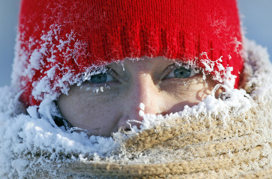 Image: Frost forms around the face of a woman walking outside in Minneapolis