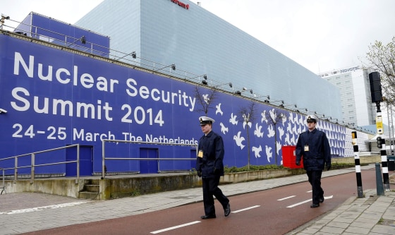 Image: Dutch Navy guards patrol near the World Forum building where the Nuclear Security Summit will take place in the Hague