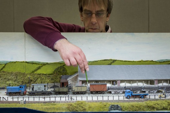 Image: Geoff Sheppard attends to his model railway set